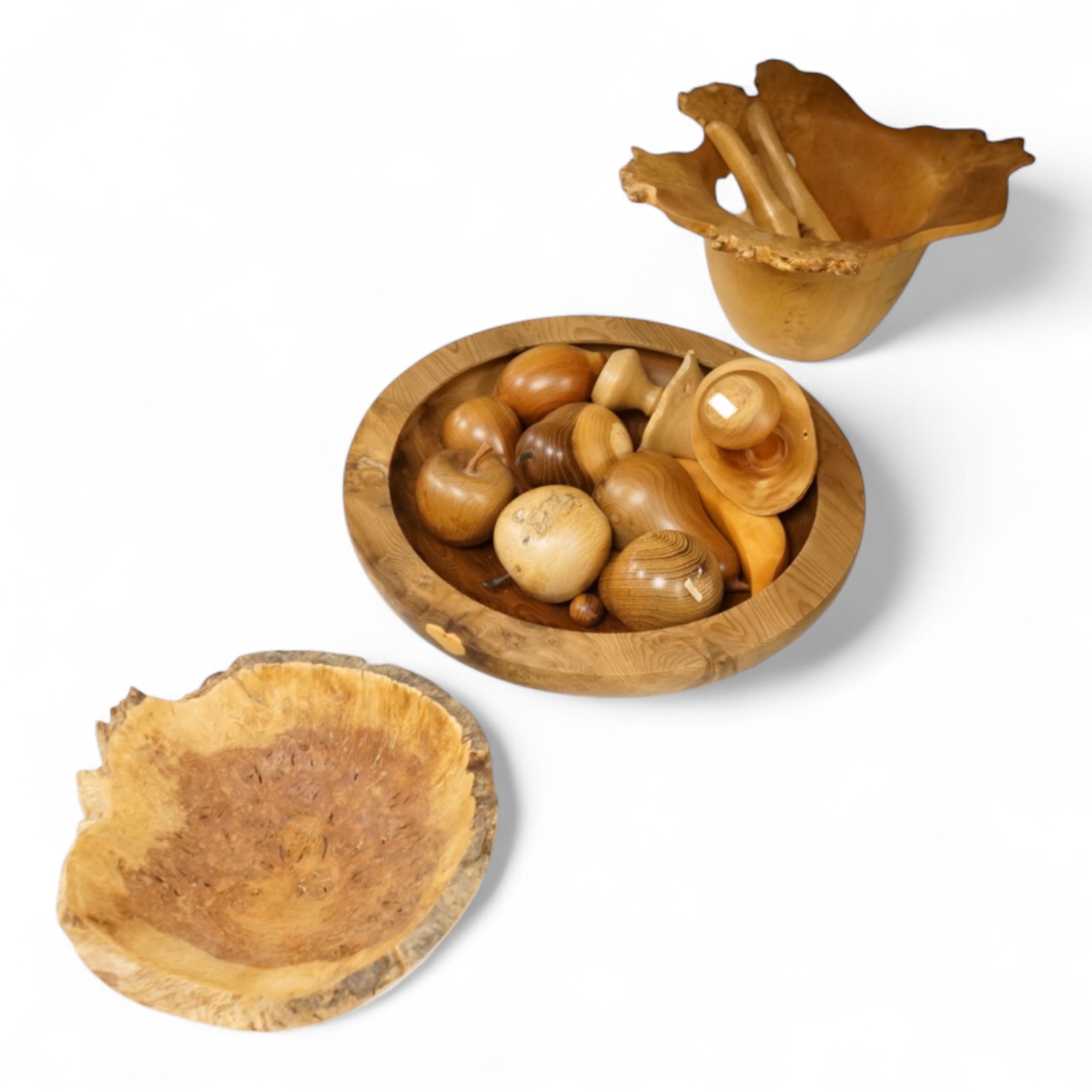 A modern treen yew bowl, a burr wood bowl and various fruit